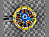 Close-up of AOS RC Supernova motor copper wire coils in gold open-frame stator