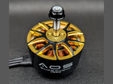 AOS Supernova 4220 brushless motor close-up showing gold top plate and copper windings