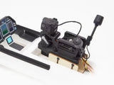 AtomRC gimbal installed in model aircraft cockpit with DJI video transmitter and dashboard