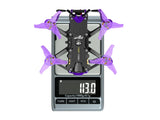 Flywoo Firefly 20 Pro drone weighing 113g on digital scale