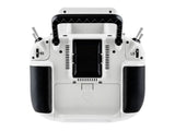 Back view of white Radiomaster GX15 featuring rubberized side grips and battery cover