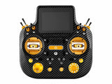 Radiomaster GX15 MAX radio controller featuring gold accents on carbon fiber body
