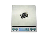 Ultra-lightweight Sequre ELRS receiver weighing 0.7 grams on scale