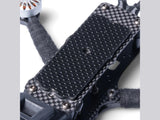Carbon fiber frame section with textured anti-vibration pad and silver motor mount screws