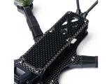 Close-up of carbon fiber mounting plate with green motor on itsFPV ERA